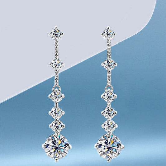 Lange Quastenohrringe mit Moissanit aus 925er Sterlingsilber.